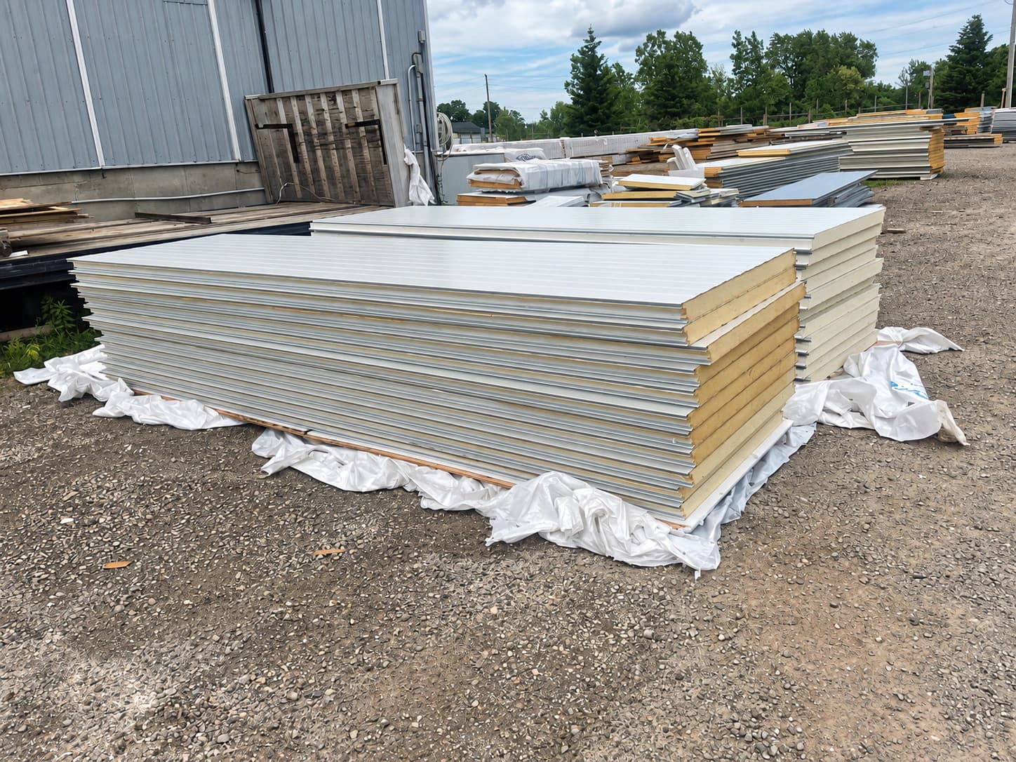 Insulated panels staged in a supply yard or prepared for transport