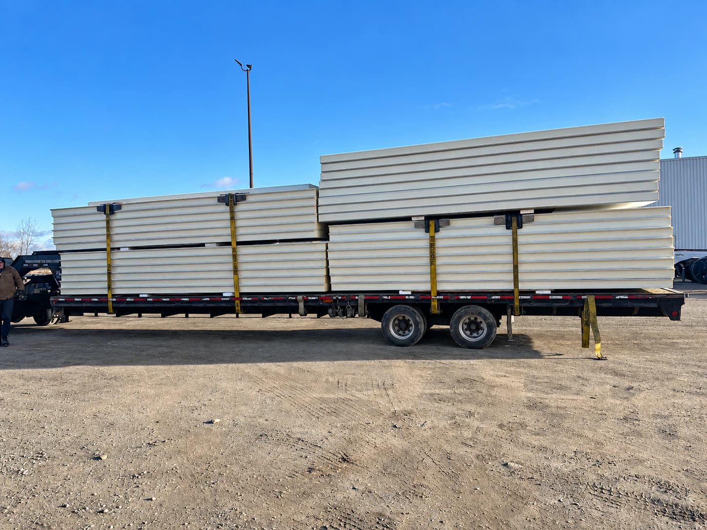 Insulated panels loaded on a trailer for transport