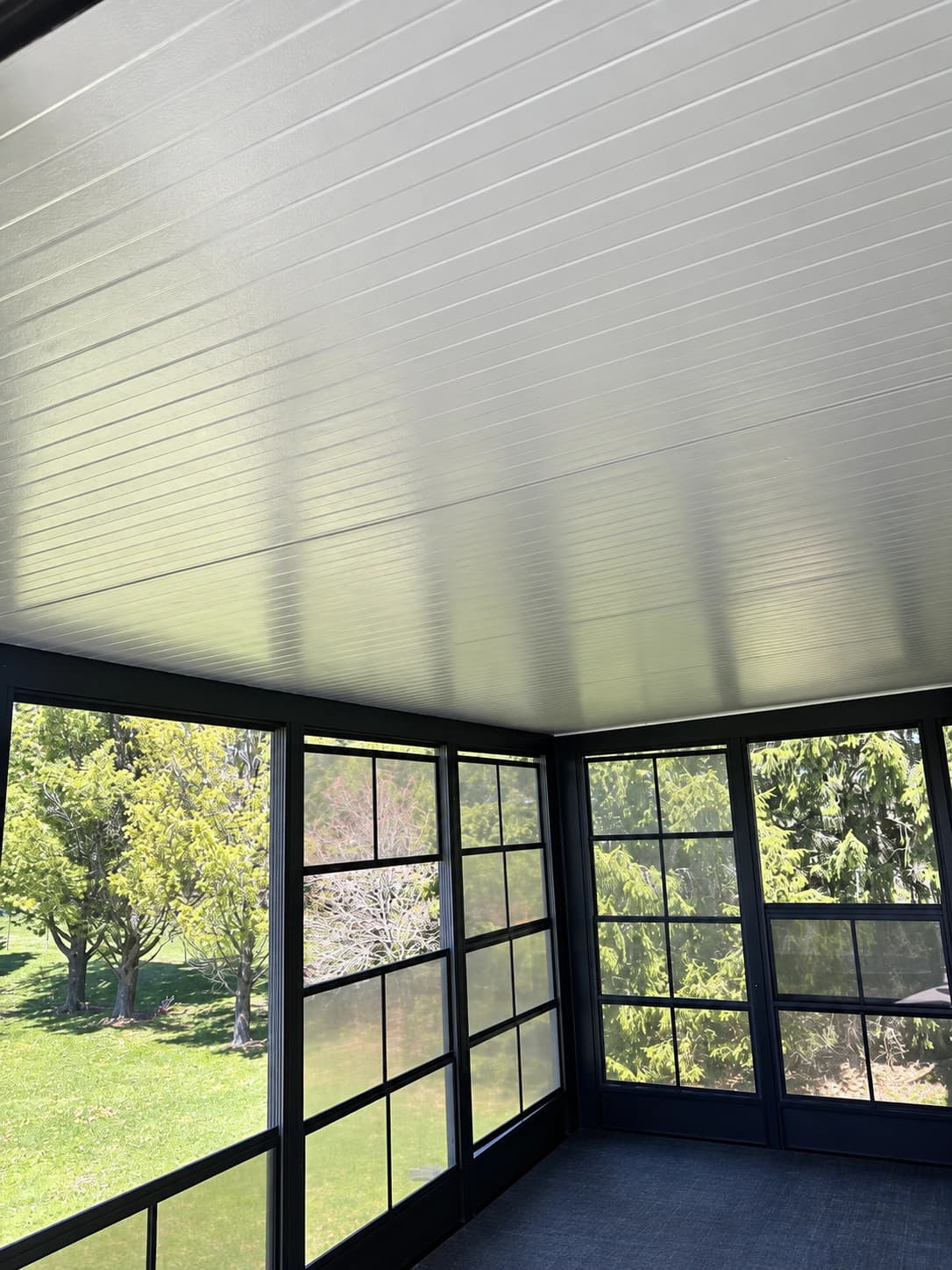 Covered outdoor structure with an insulated roof