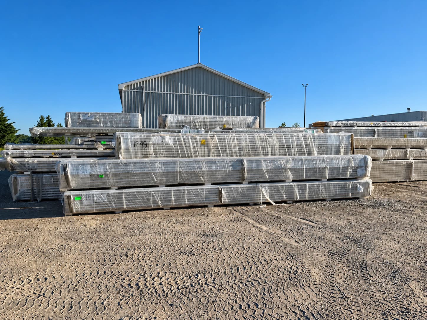 Insulated panels staged in a supply yard or prepared for transport